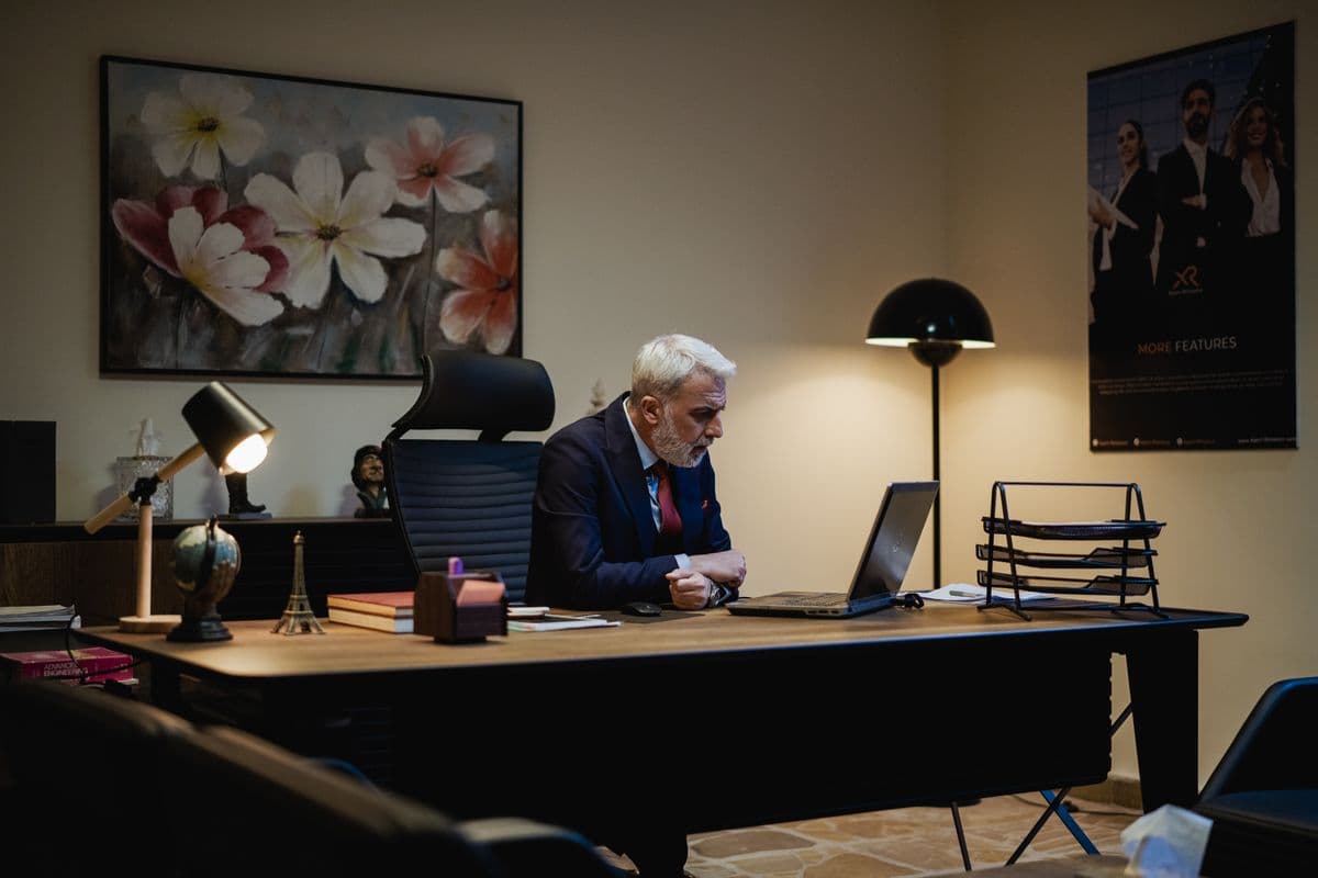 A business owner working at his office desk